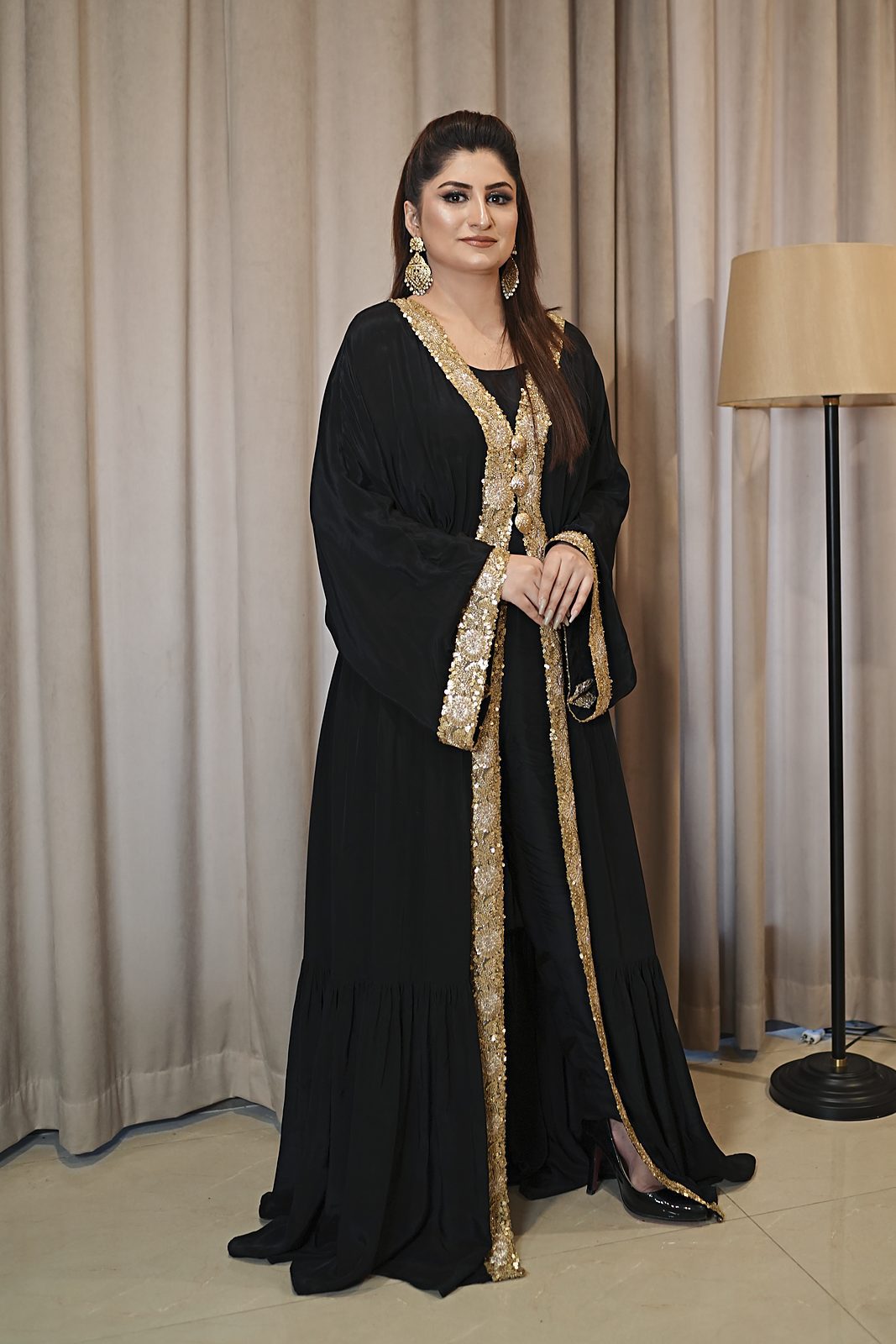 Black Russian silk open gown with gold cutdana borders, front view