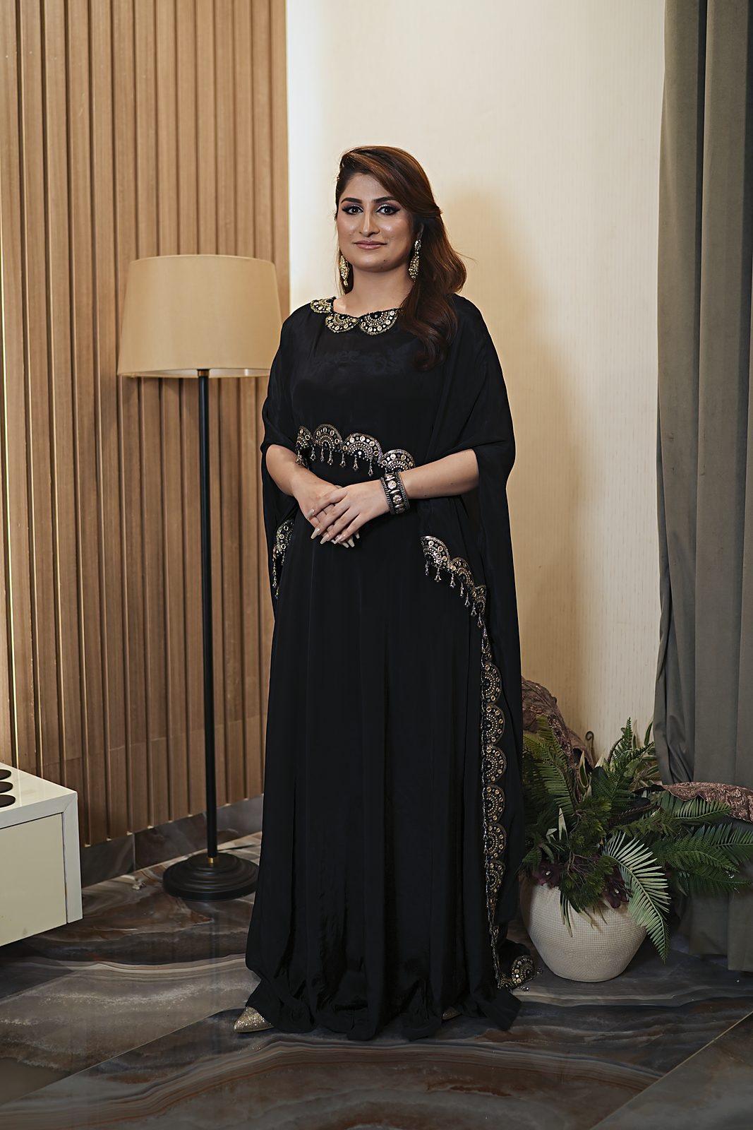 Black Russian silk cape dress with D lace borders and grey and gold moti fringe, front view