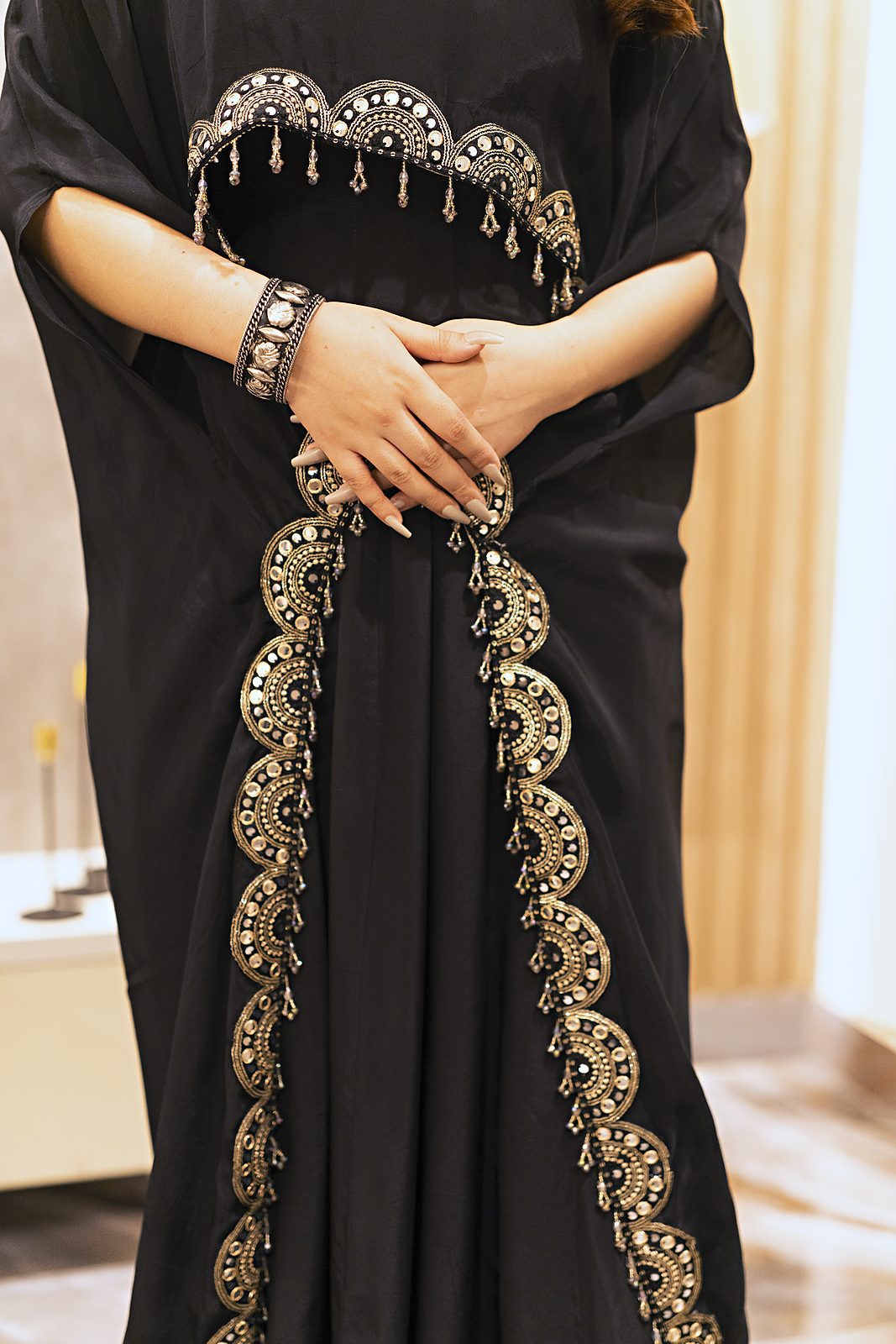 Front borders of the cape with D lace and hanging grey and gold moti fringe