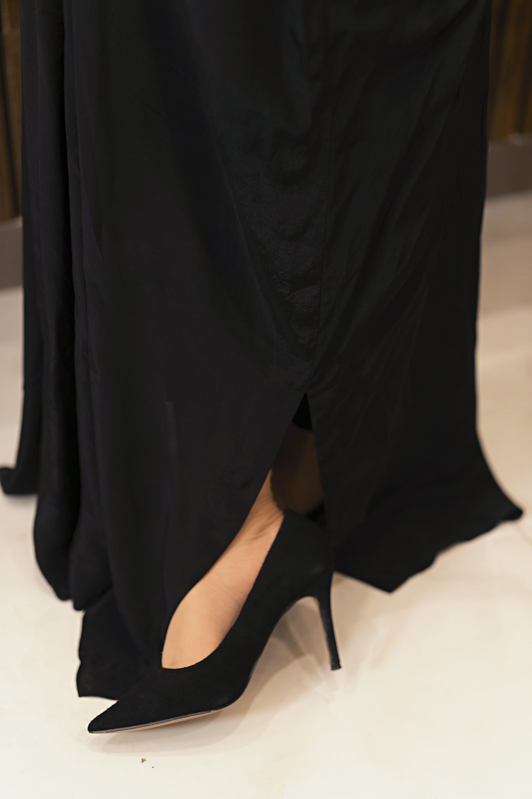 Hem and side slit of the black Russian silk kaftan