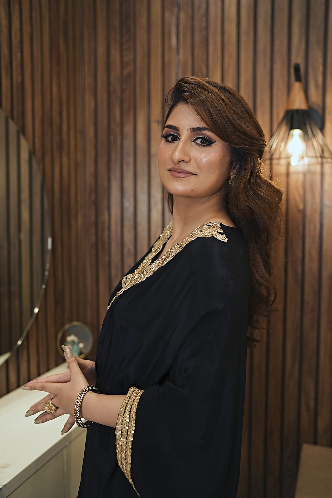 Side portrait in the black kaftan with gold lace neckline