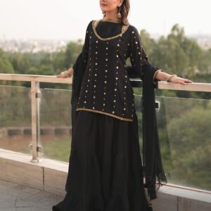 Black Thai silk short shirt with gold motifs, three-tier sharara and organza dupatta, front view
