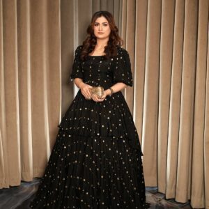 Black Thai silk tiered frock with printed gold motifs and puff sleeves, front view
